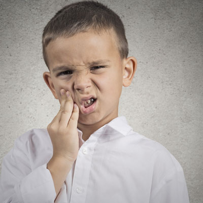 Kid with tooth pain